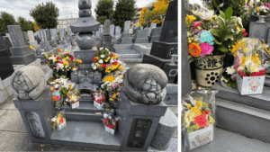 覚證寺にある水木しげるさんのお墓。供えられた花束と鬼太郎・目玉おやじの石像が並ぶ