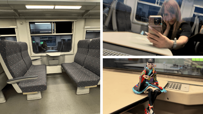SNCB車内のボックス席と窓越しに写る筆者、モノノ怪の薬売りフィギュア